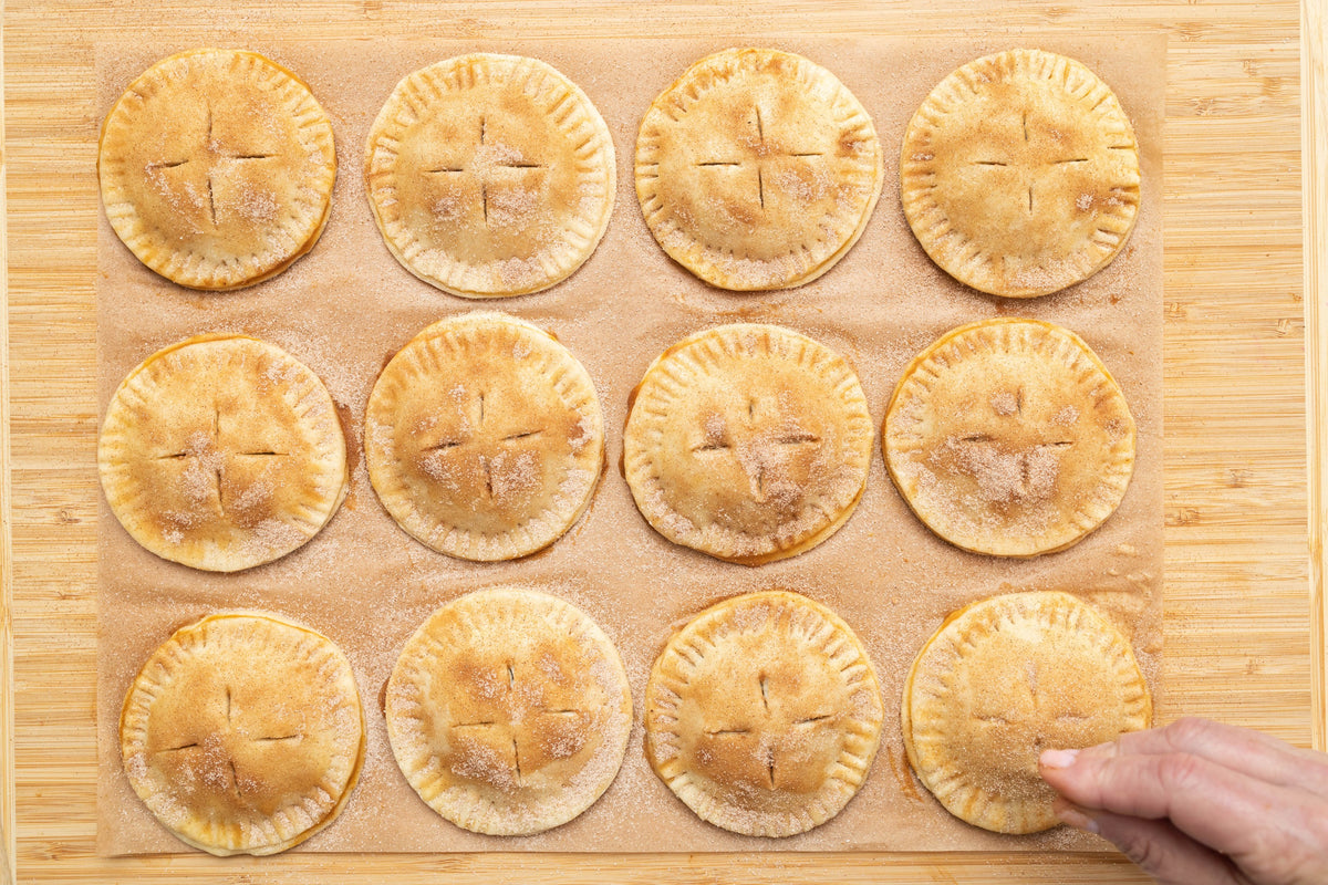 Golden baked Pumpkin Spice Hand Pies fresh from the oven