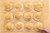 Golden baked Pumpkin Spice Hand Pies fresh from the oven
