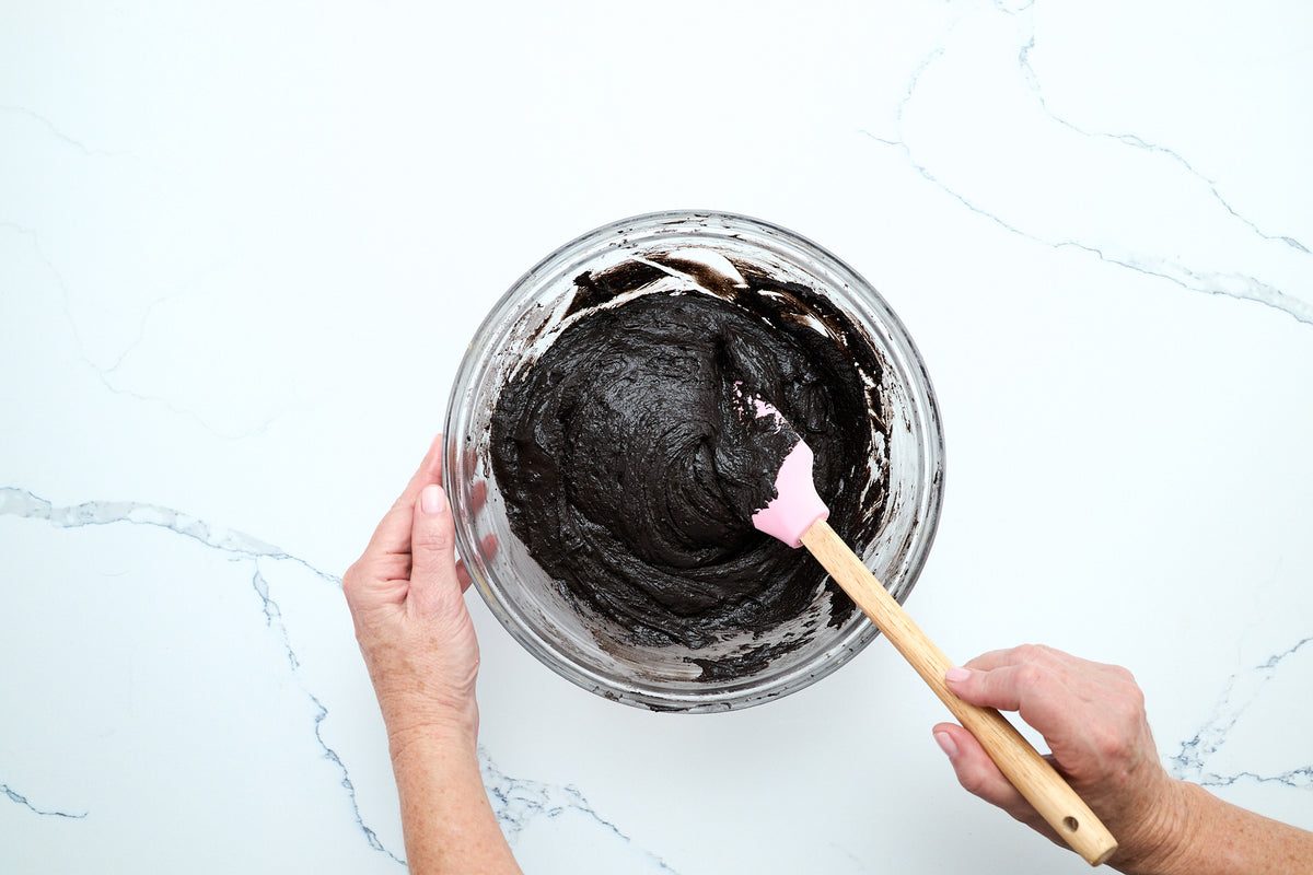 Folding the dark chocolate whoopie pie batter with a spatula
