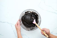 Folding the dark chocolate whoopie pie batter with a spatula
